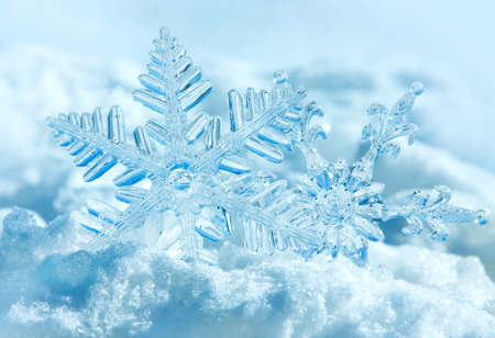 Christmas decorations snowflakes on a snow background of nature