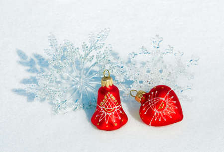 Christmas decorations on a snow background of natureの写真素材