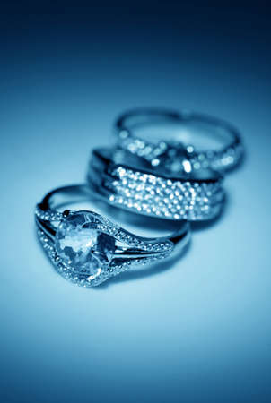 Jewelry accessories - golden rings in blue lightの写真素材