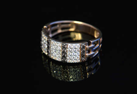 Golden jewelry accessories  with brilliants on black background