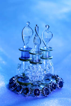 Golden jewelry accessories  with brilliants  and glass on blue silk