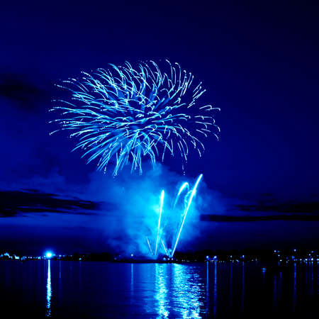 Celebratory bright firework in a night sky の写真素材