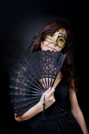 Pretty young woman in Carnival Venetian mask