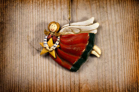 Angel on wood backround for celebratory cardの写真素材