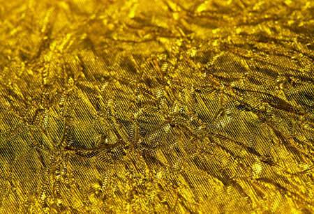 Golden texture, gold foil close up backgroundの写真素材