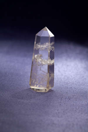 Quartz mineral ( rock) crystal) on a grey background の写真素材