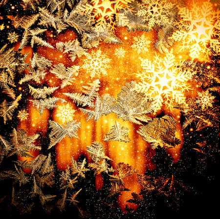 Frosty natural pattern at a winter window glassの写真素材