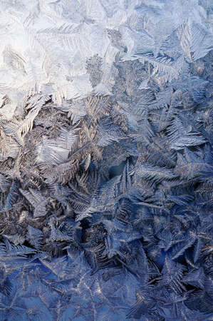 Winter frosty window glass, natural texture of natureの写真素材