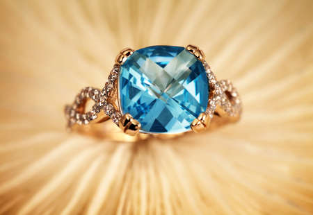Golden jewelry rings with blue topazの写真素材