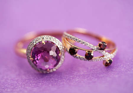 Elegant female jewelry rings with jewel gem stone amethyst and garnets