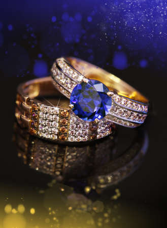 Elegant jewelry two rings with Sapphire and diamonds on black backgroundの写真素材