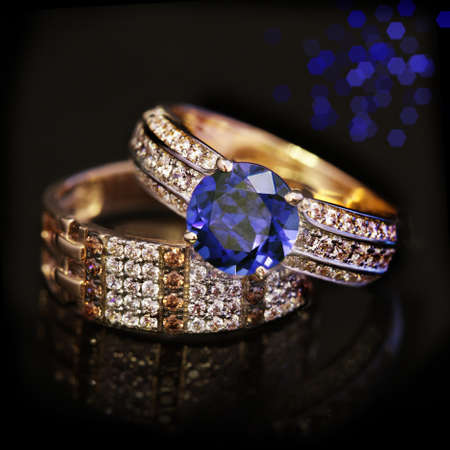 Elegant jewelry two rings with Sapphire and diamonds on black backgroundの写真素材
