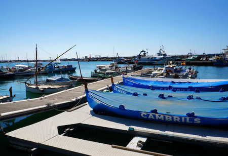 Cambrils, Spain - may 16, 2016: View of port and city waterfront , yahts and boatsのeditorial素材