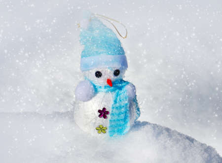 Christmas decoration in snow, snowman outdoor shot on natural snowの写真素材