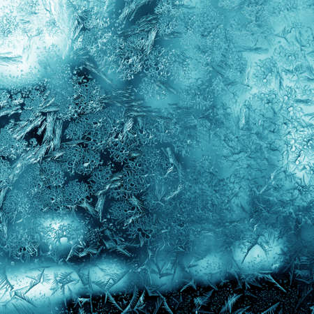 Natural frosty pattern on a winter windowの写真素材
