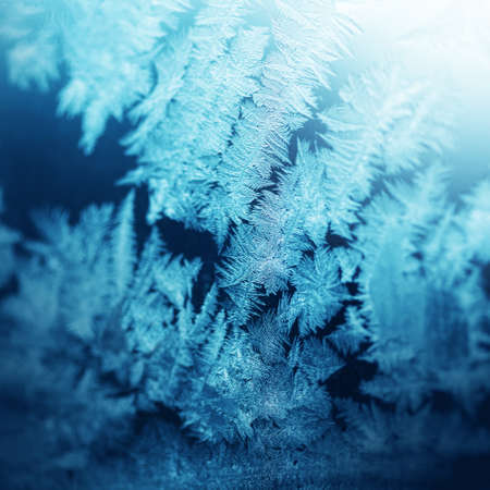 Natural frosty pattern on a winter windowの写真素材