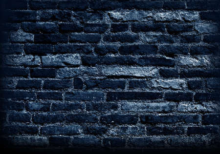 Old wall of bricks in night , a natural texture backgroundの写真素材
