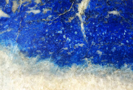 Lazurite (lapis lazuli) background close-up, blue natural textureの写真素材