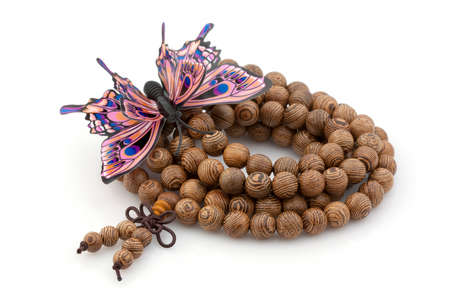 Bracelet made of wooden beads with butterflyの写真素材