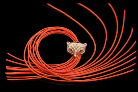 Cord for braiding ornaments and bracelets through dividers with holesの写真素材