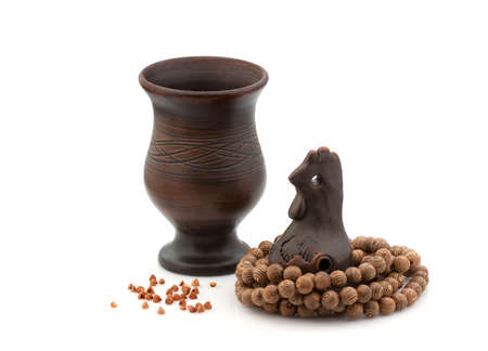 Pottery handmade, the cock pecks buckwheat groatsの写真素材