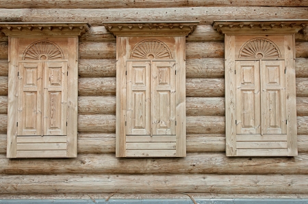 three wooden closed shutters on the windowsの写真素材