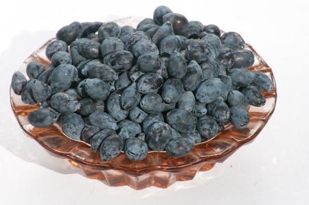 Honeyberries in the plateの写真素材