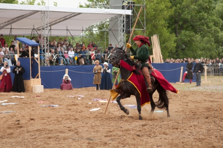 Moscow, Russia-  June 22, 2013: Times and Epoch-2013 festival in Kolomenskoye park. The Middle Ages (Srednevekove). Knight on a horse in a historical reconstruction on the joust.のeditorial素材