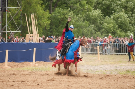 Moscow, Russia-  June 22, 2013: Times and Epoch-2013 festival in Kolomenskoye park. The Middle Ages (Srednevekove). Knight on a horse in a historical reconstruction on the joust.のeditorial素材