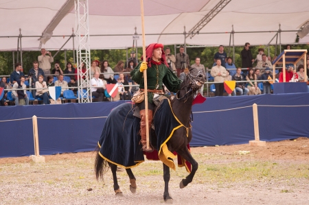 Moscow, Russia - June 22, 2013: Times and Epoch-2013 festival in Kolomenskoye park,. The Middle Ages (Srednevekove). Knight on a horse in a historical reconstruction on the joust.のeditorial素材