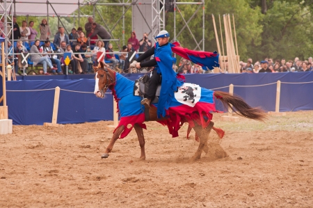 Moscow, Russia - June 22, 2013: Times and Epoch-2013 festival in Kolomenskoye park,. The Middle Ages (Srednevekove). Knight on a horse in a historical reconstruction on the joust.のeditorial素材