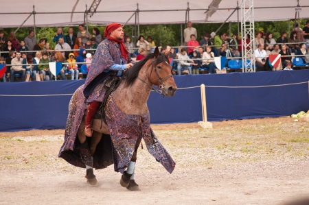Moscow, Russia- June 22, 2013: Times and Epoch-2013 festival in Kolomenskoye park,. The Middle Ages (Srednevekove). Knight on a horse in a historical reconstruction on the joust.のeditorial素材