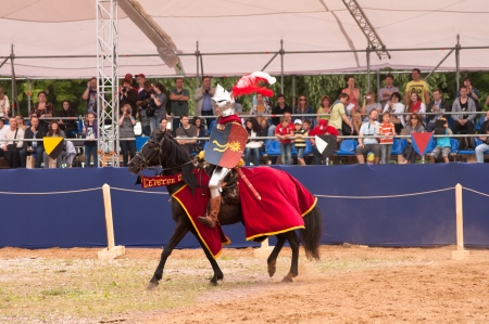 Moscow, Russia - June 23, 2013: Times and Epoch-2013 festival in Kolomenskoye park. The Middle Ages (Srednevekove). Knight on a horse in a historical reconstruction on the joust.のeditorial素材