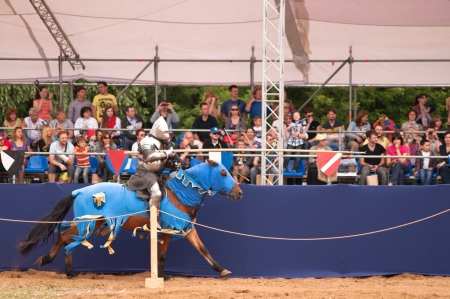 Moscow, Russia - June 23, 2013: Times and Epoch-2013 festival in Kolomenskoye park. The Middle Ages (Srednevekove). Knight on a horse in a historical reconstruction on the joust.のeditorial素材