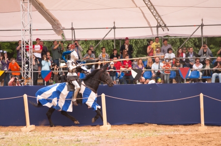 Moscow, Russia - June 23, 2013: Times and Epoch-2013 festival in Kolomenskoye park. The Middle Ages (Srednevekove). Knight on a horse in a historical reconstruction on the joust.のeditorial素材