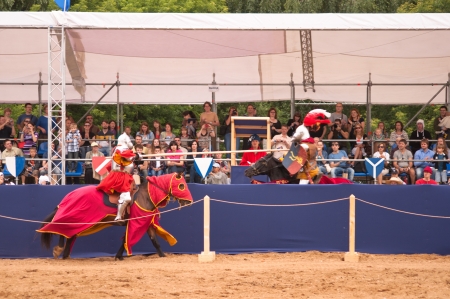 Moscow, Russia - June 23, 2013: Times and Epoch-2013 festival in Kolomenskoye park. The Middle Ages (Srednevekove). Knight on a horse in a historical reconstruction on the joust.のeditorial素材