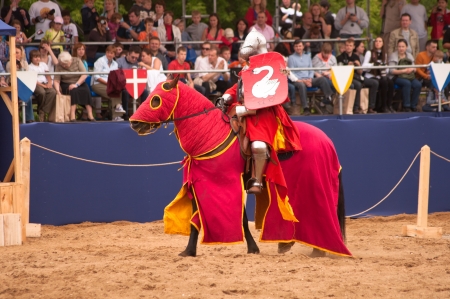 Moscow, Russia - June 23, 2013: Times and Epoch-2013 festival in Kolomenskoye park. The Middle Ages (Srednevekove). Knight on a horse in a historical reconstruction on the joust.のeditorial素材