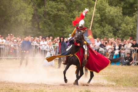 Moscow, Russia - June 23, 2013: Times and Epoch-2013 festival in Kolomenskoye park. The Middle Ages (Srednevekove). Knight on a horse in a historical reconstruction on the joust.のeditorial素材