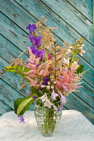 Still life bouquet with astilbe, hosta and bluebellsの写真素材