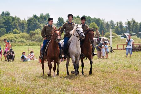 MOSCOW REGION, DUSHONOVO VILLAGE - JULY 6, 2013, dushonovskiye maneuvers festival. - Unidentified horsemen galloping on a stallions in a historical reconstruction.のeditorial素材