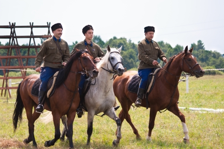 MOSCOW REGION, DUSHONOVO VILLAGE - JULY 6, 2013, dushonovskiye maneuvers festival. - Unidentified horsemen galloping on a stallions in a historical reconstruction.のeditorial素材