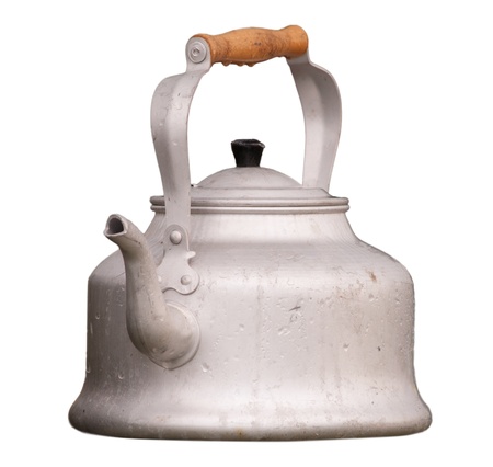 old aluminium kettle isolated on whiteの写真素材