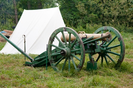 old cannon standing on the ground near the tentの写真素材