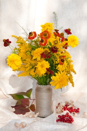 yellow flowers still life bouquet with berriesの写真素材