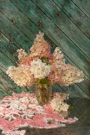 wet still life with pink hydrangea bouquetの写真素材