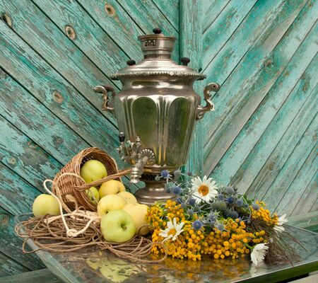 still life with samovar, flowers and applesの写真素材