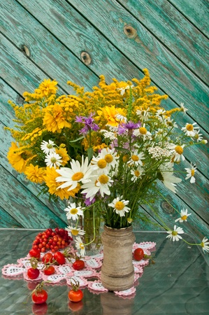 two wild flowers bouquets on the table still lifeの写真素材