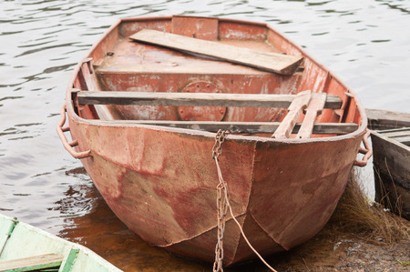 one boat on the water near the bank