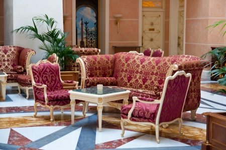 armchairs and chairs near the table interiorの写真素材