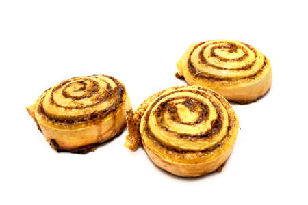 Fresh and tasty three sweet cinnamon rolls bun Isolated on white backgroundの写真素材